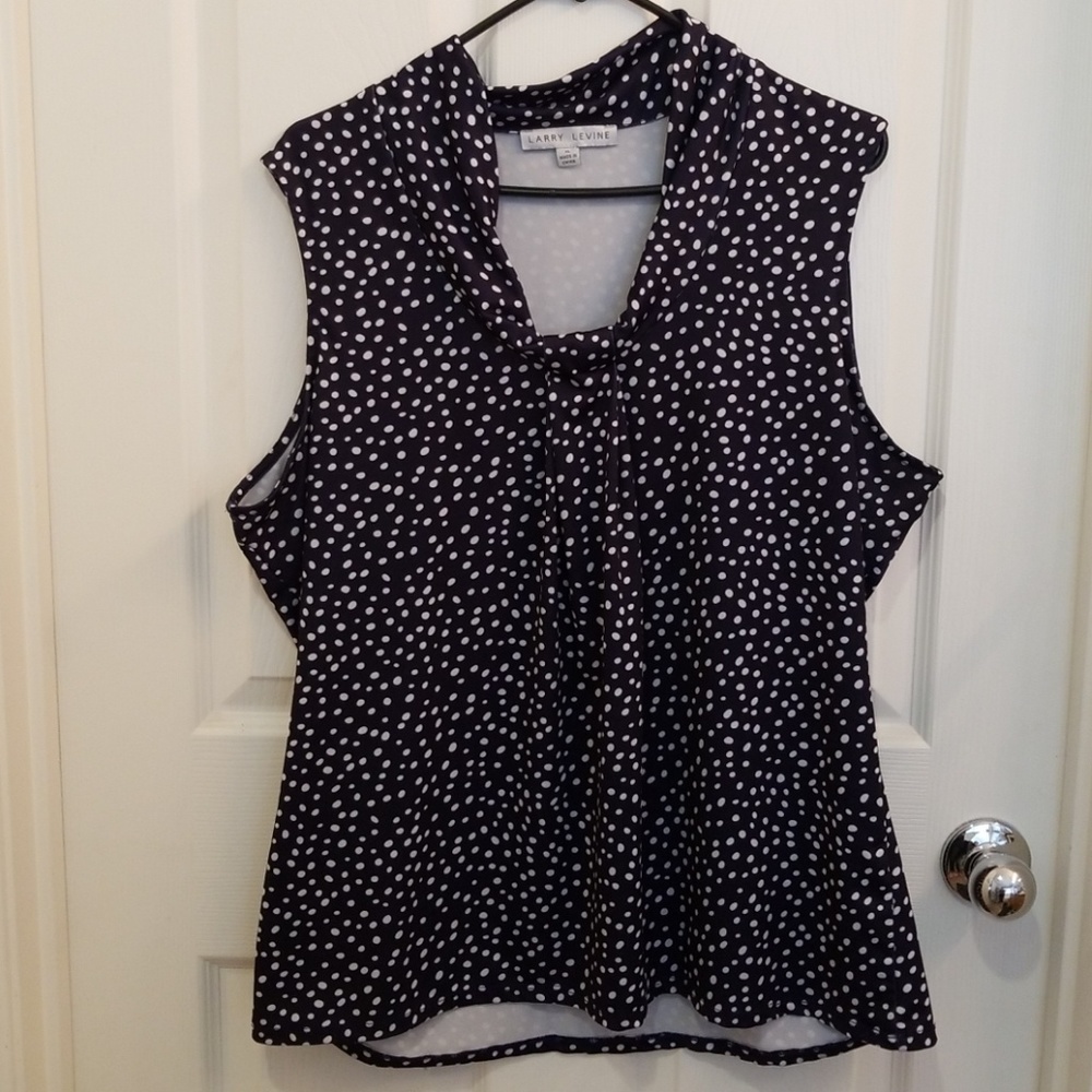 Navy poka dot sleeveless top.